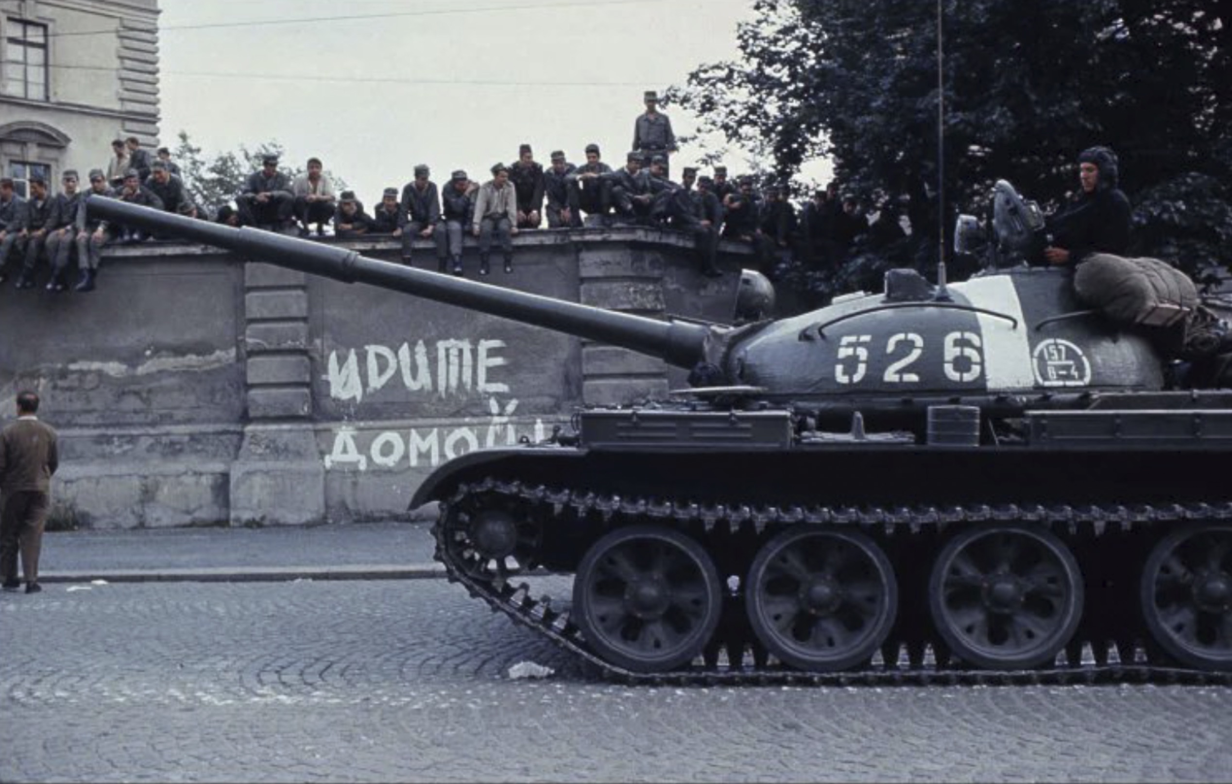 Czechoslovak conscripts look on from the walls of Žižkov barracks as a Soviet T-62 drives into the city of České Budějovice during the Warsaw Pact invasion of Czechoslovakia, 22nd of August 1968. 
